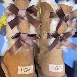 Uggs with two bows on the back. Great condition, only worn twice!!